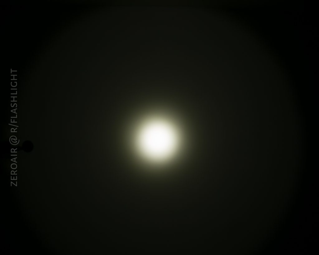 A bright white circular light, reminiscent of the Eagle Eye X7 Flashlight, is centered against a dark background, creating a halo effect. Text along the left side reads ZEROAIR @ R/FLASHLIGHT.