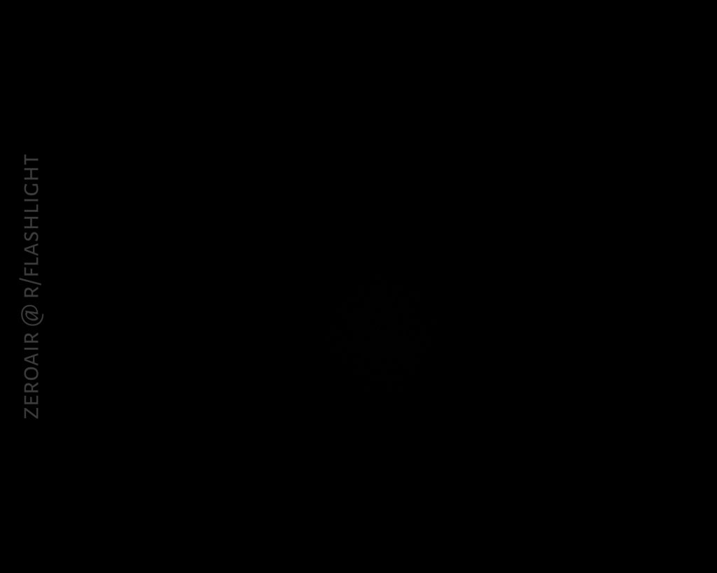A mostly black image with very faint, barely visible details in the center. White vertical text along the left edge reads, “ZEROAIR @ R/FLASHLIGHT.”