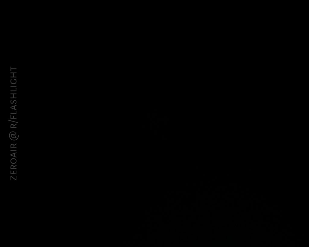 A completely dark image with a vertical watermark on the left side that reads ZEROAIR @ R/FLASHLIGHT. No objects or details are visible.
