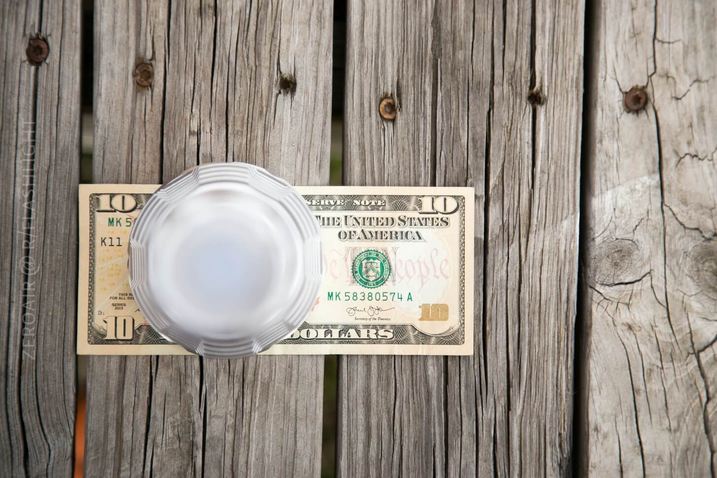 Convoy L6 Clear Flashlight on money bill