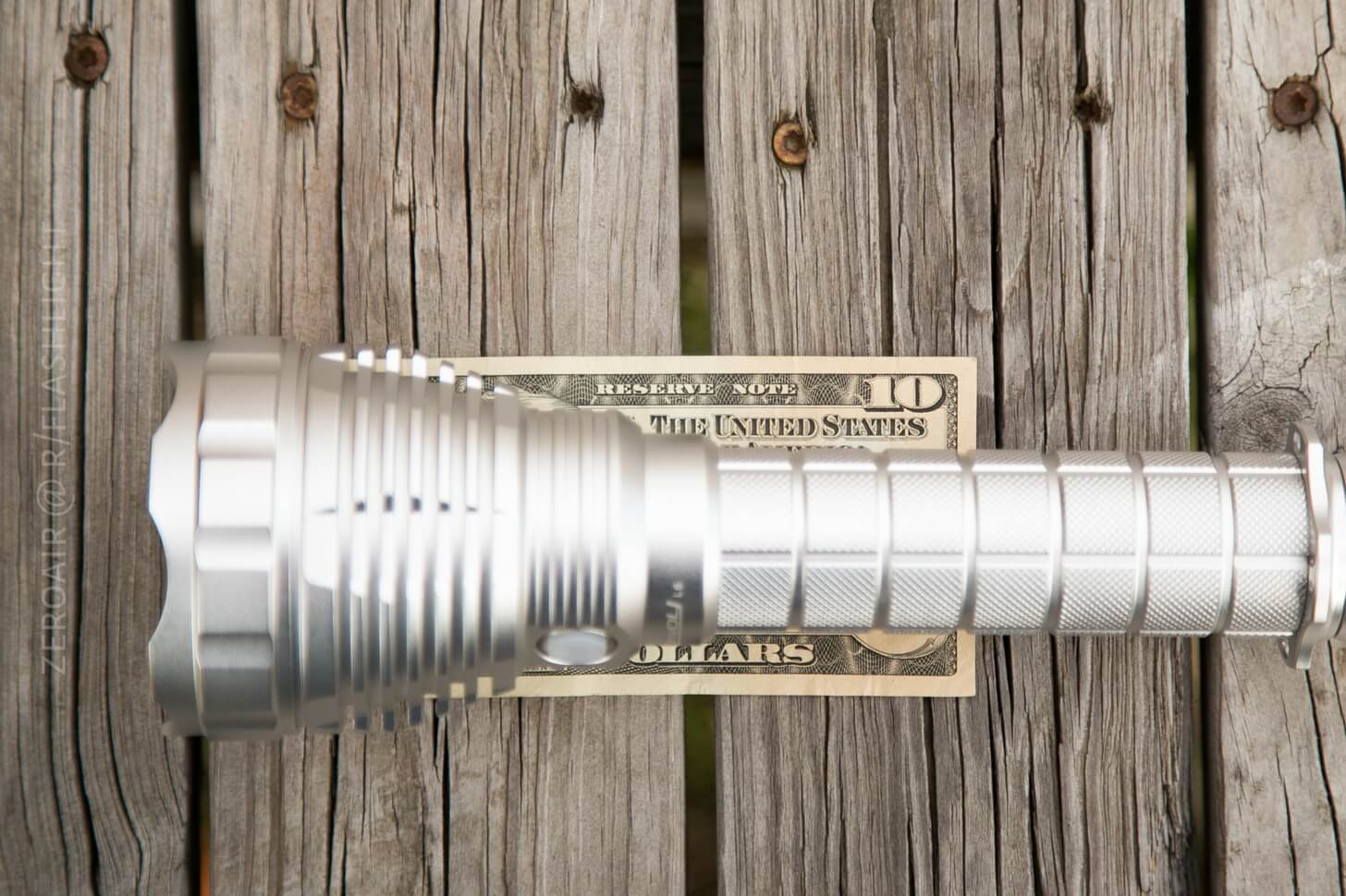 Convoy L6 Clear Flashlight on money bill