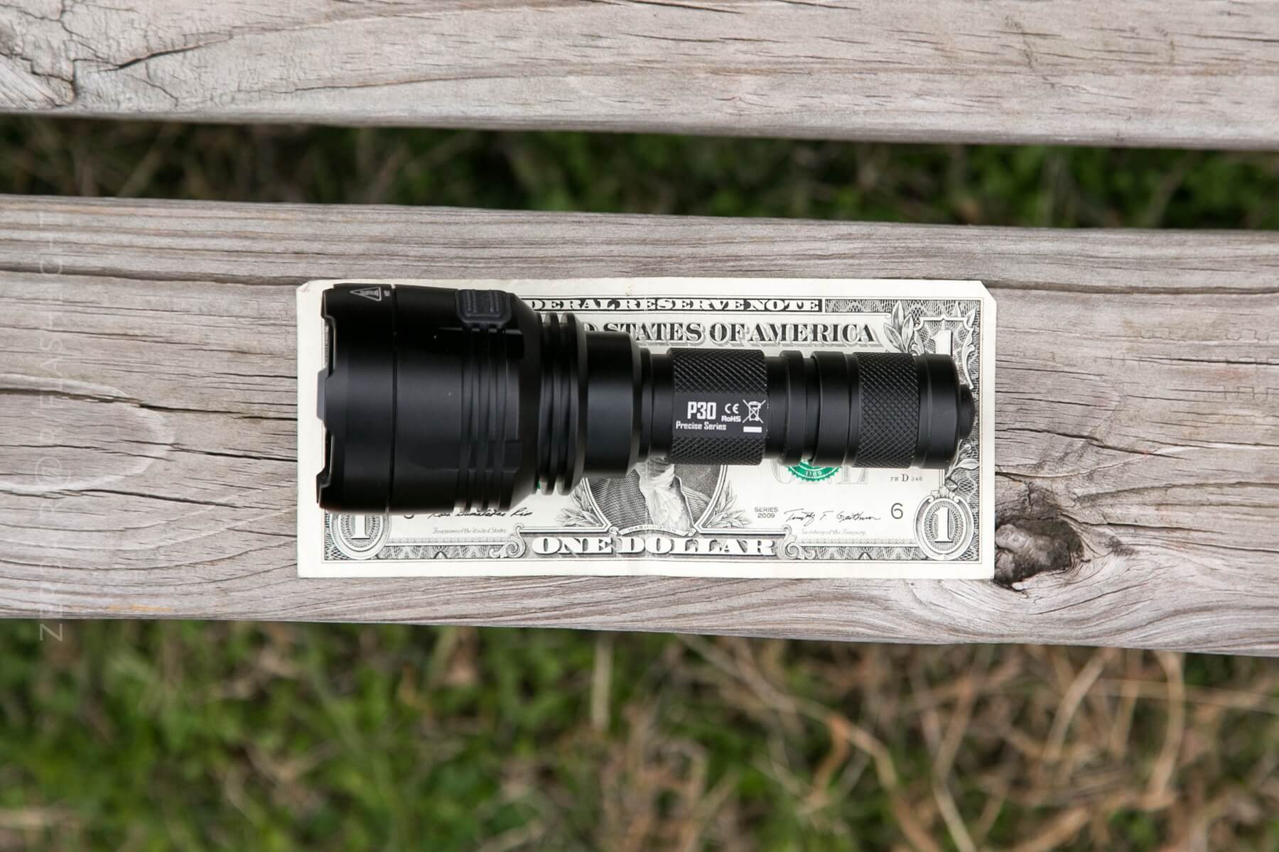 Nitecore P30 Flashlight on dollar bill