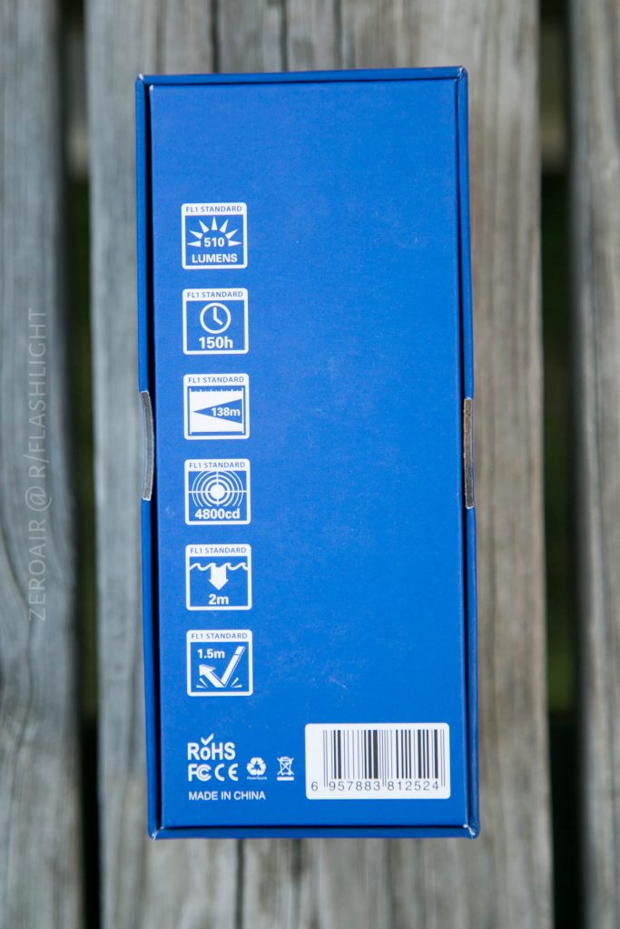 A blue product box displays icons and text indicating 510 lumens brightness, 150 hours runtime, 138 meters beam distance, 4800 candela peak beam intensity, and 1.5 meters impact resistance.