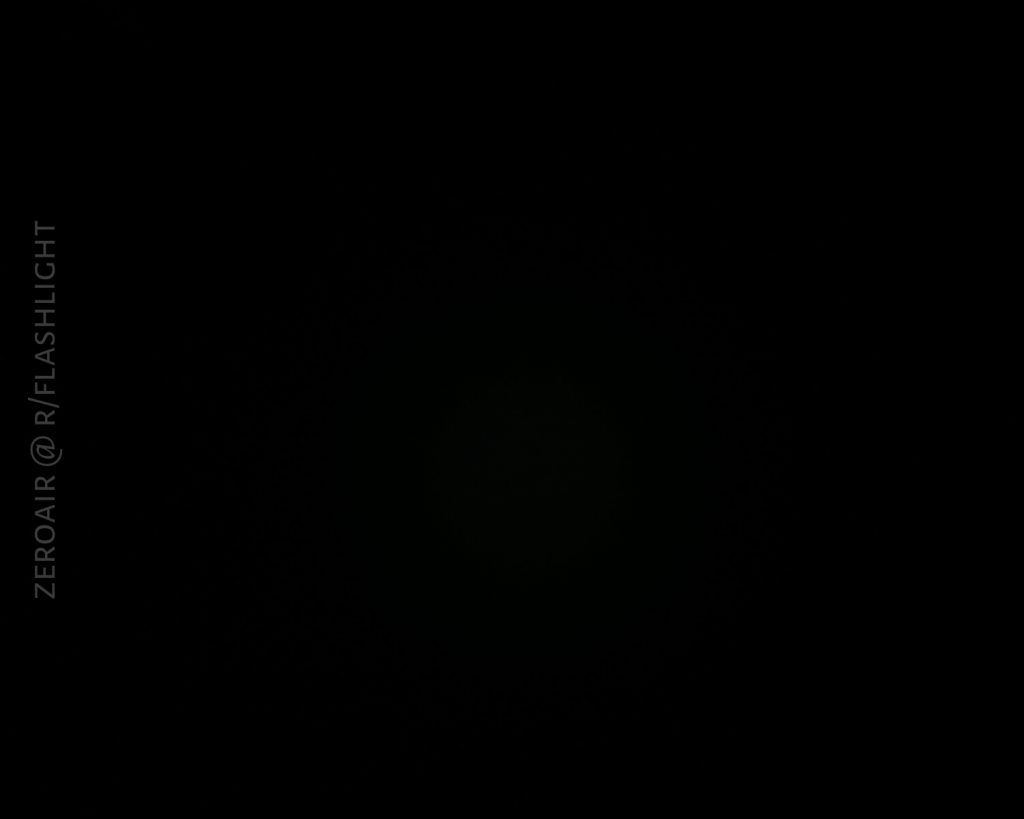 A nearly black image with very faint light in the center. The text ZEROAIR @ R/FLASHLIGHT appears vertically on the left side.