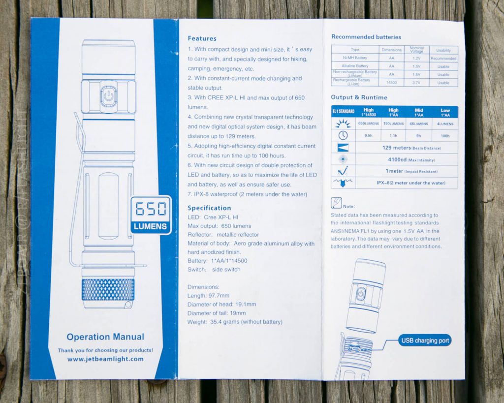 An instruction manual for a flashlight showing a diagram of the product, its features, specifications, output and runtime table, recommended batteries, and a note about the USB charging port.
