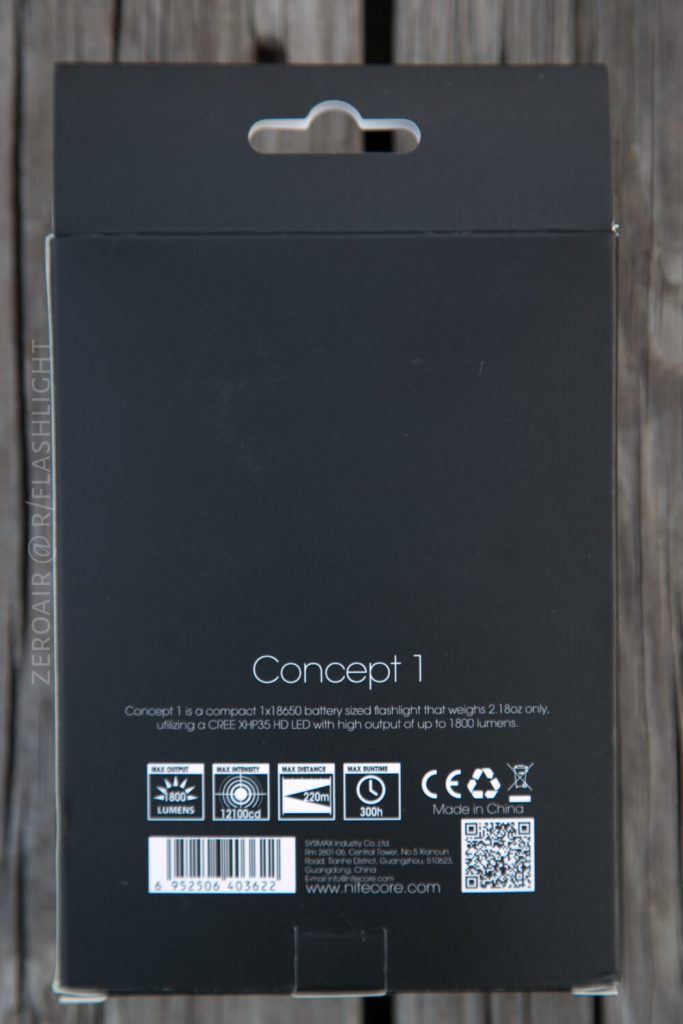 The back of a black product box for the Nitecore Concept 1 flashlight, showing technical specifications, barcodes, and icons indicating features like 1800 lumens, 220 meters range, and battery type.