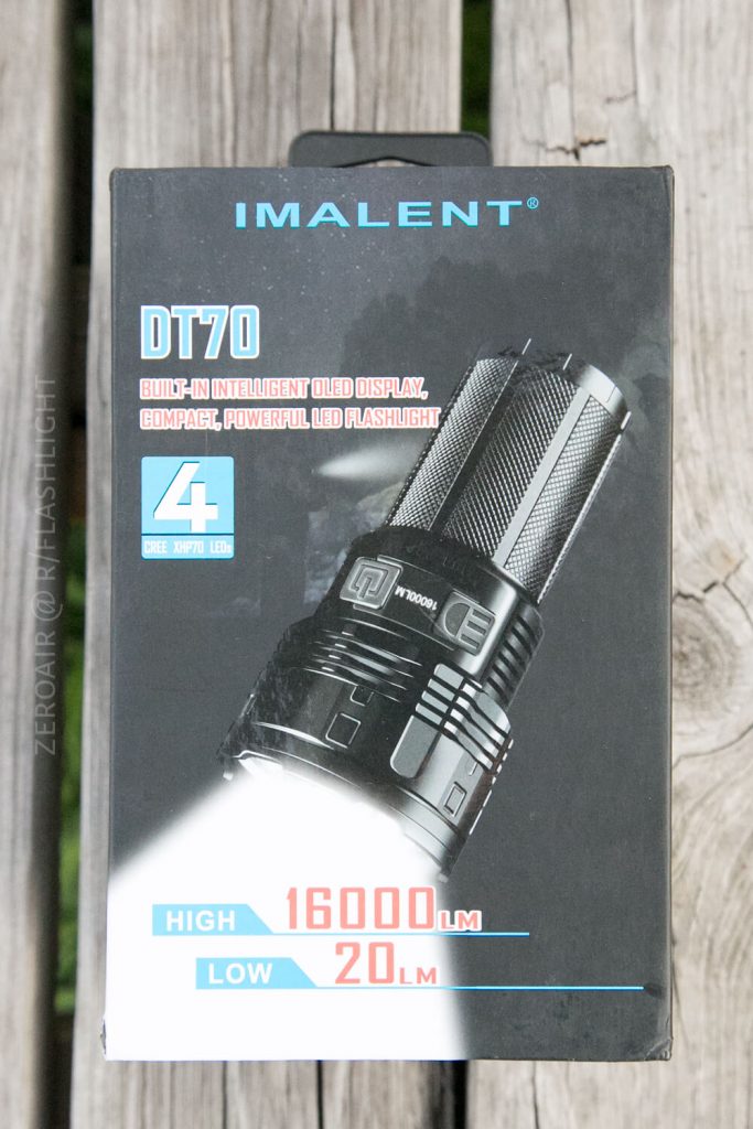 A retail box for the Imalent DT70 LED flashlight showing an image of the flashlight and text highlighting features: 4 CREE XHP70 LEDs, high 16000 lumens, low 20 lumens, and a built-in intelligent OLED display.