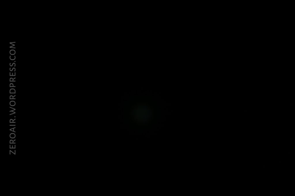 A nearly black image with faint, barely visible light in the center and the text ZEROAIR.WORDPRESS.COM vertically along the left side.