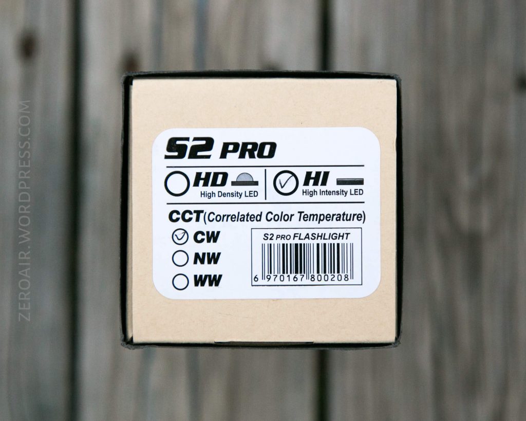 A product box labeled S2 Pro with options for HD (High Density LED) and HI (High Intensity LED). It lists CCT options: CW, NW, WW, with a barcode and some text on a wood surface background.