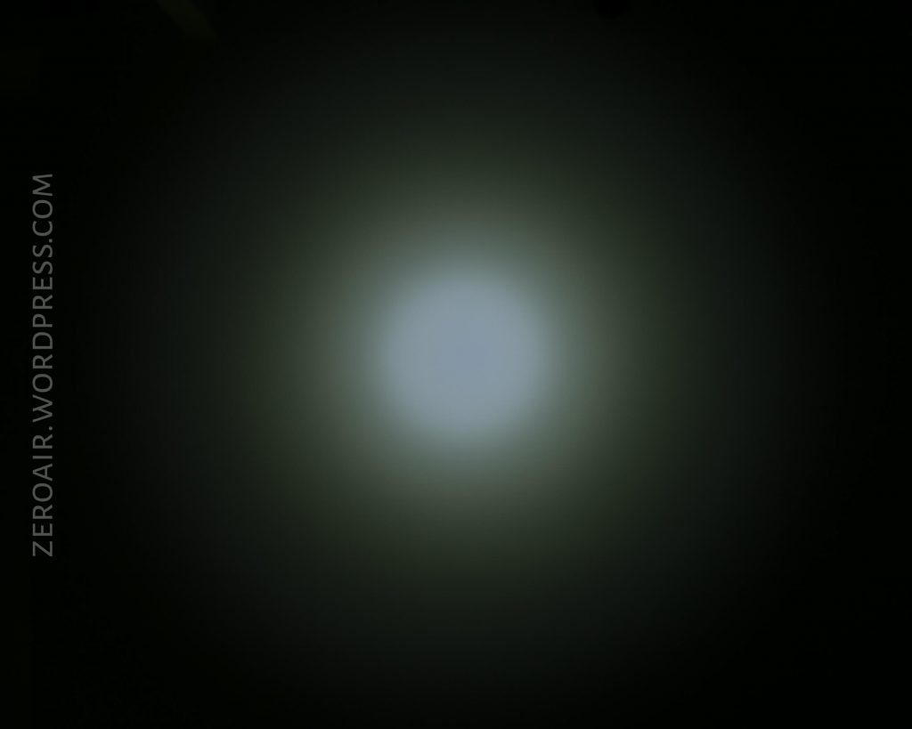 A circular white light is shown against a dark background, gradually fading in brightness toward the edges. The text ZEROAIR.WORDPRESS.COM appears vertically along the left side.