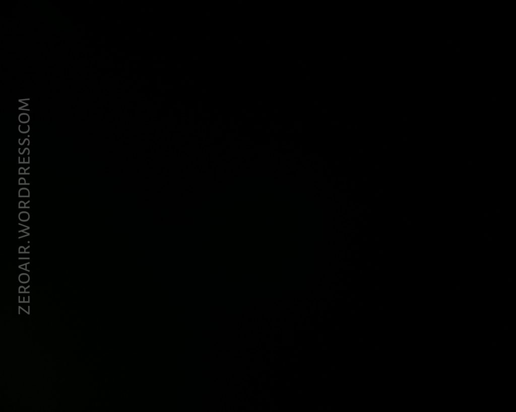 A completely black image with the text ZEROAIR.WORDPRESS.COM written vertically along the left side. No objects or details are visible.