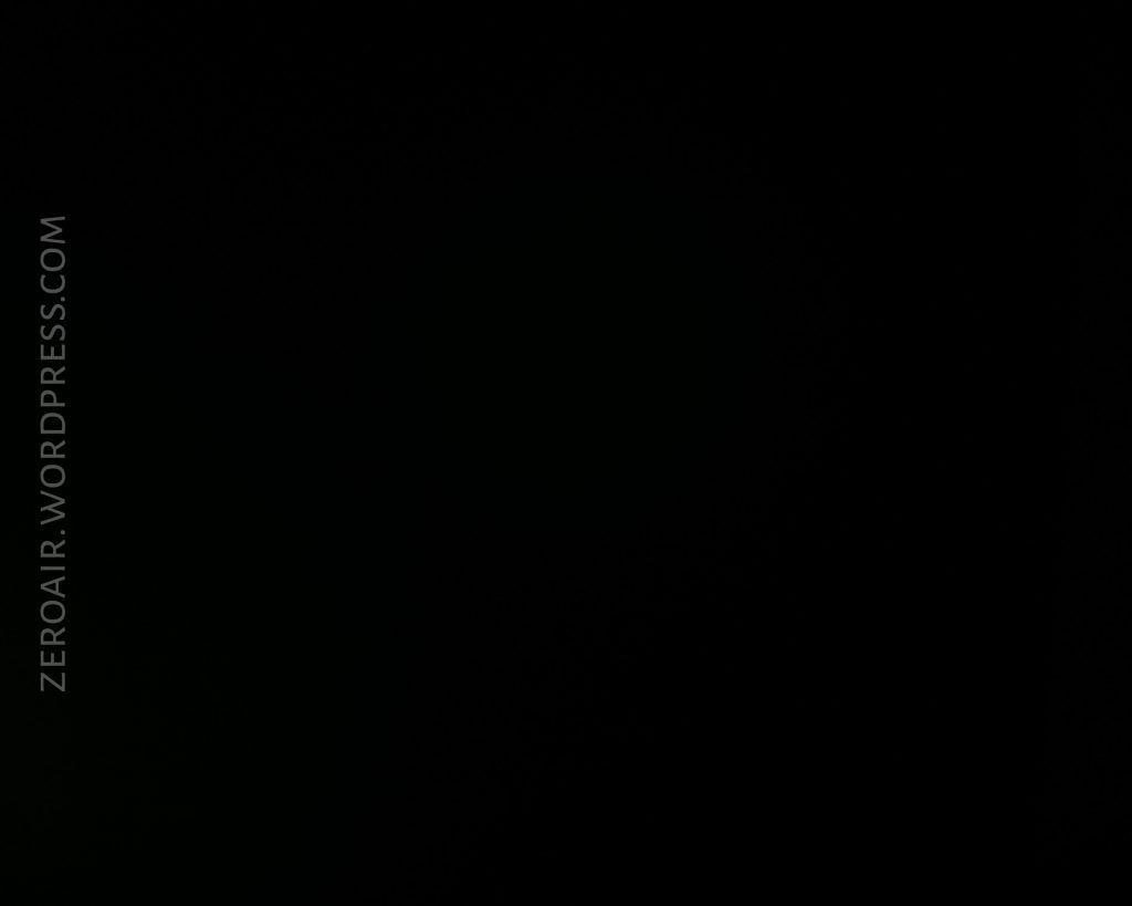 A completely black image with the text ZEROAIR.WORDPRESS.COM written vertically along the left side. No discernible objects or features are visible.