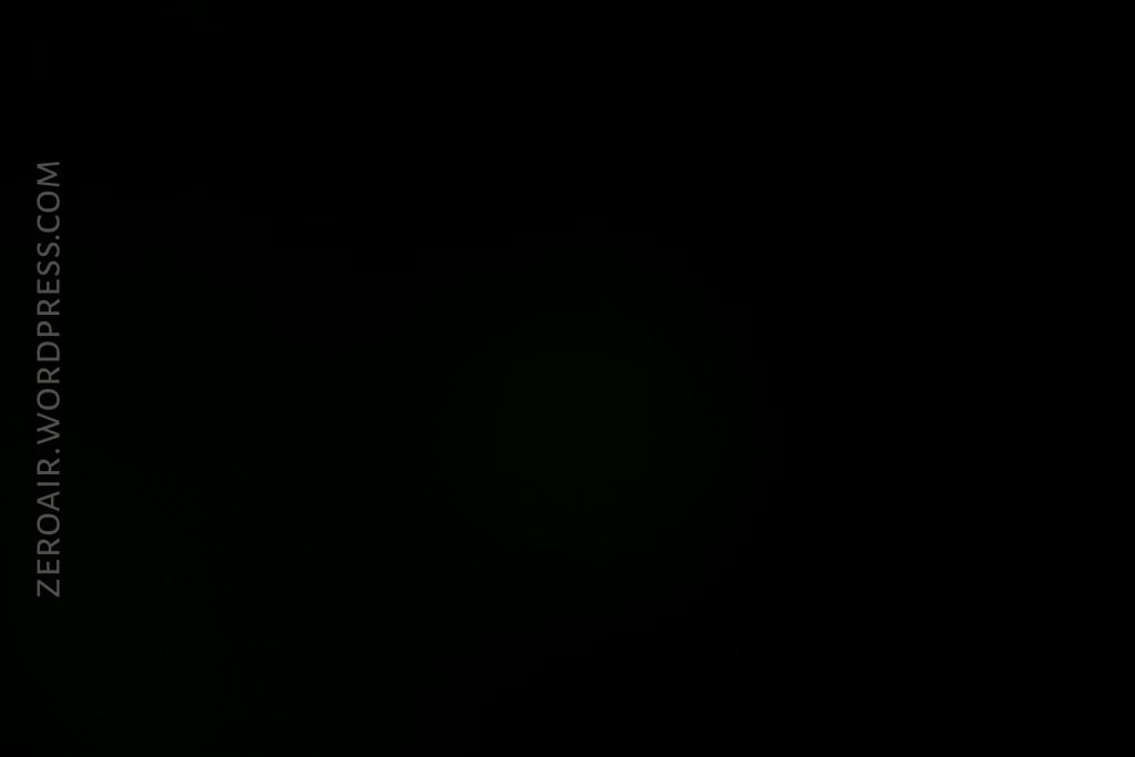 A completely black image with the text ZEROAIR.WORDPRESS.COM written vertically on the left side. No other visible details.