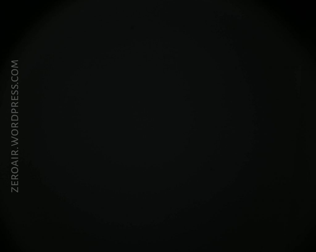 A mostly black image with the text ZEROAIR.WORDPRESS.COM vertically aligned on the left side. The rest of the image appears dark with no distinguishable objects.