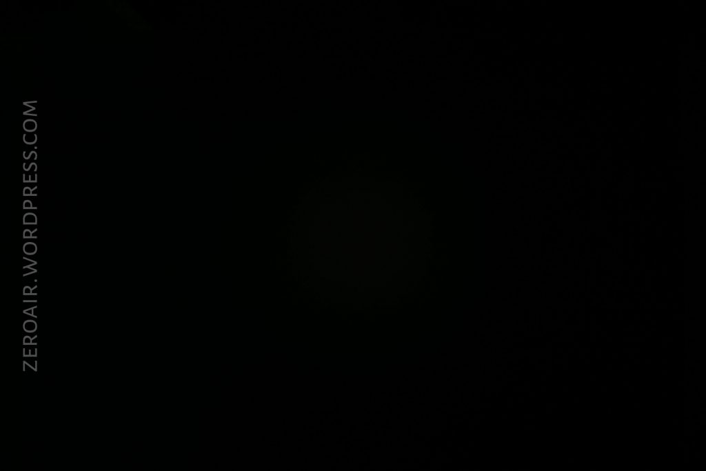 A completely dark or black image with no visible features. The text ZEROAIR.WORDPRESS.COM appears vertically on the left side.