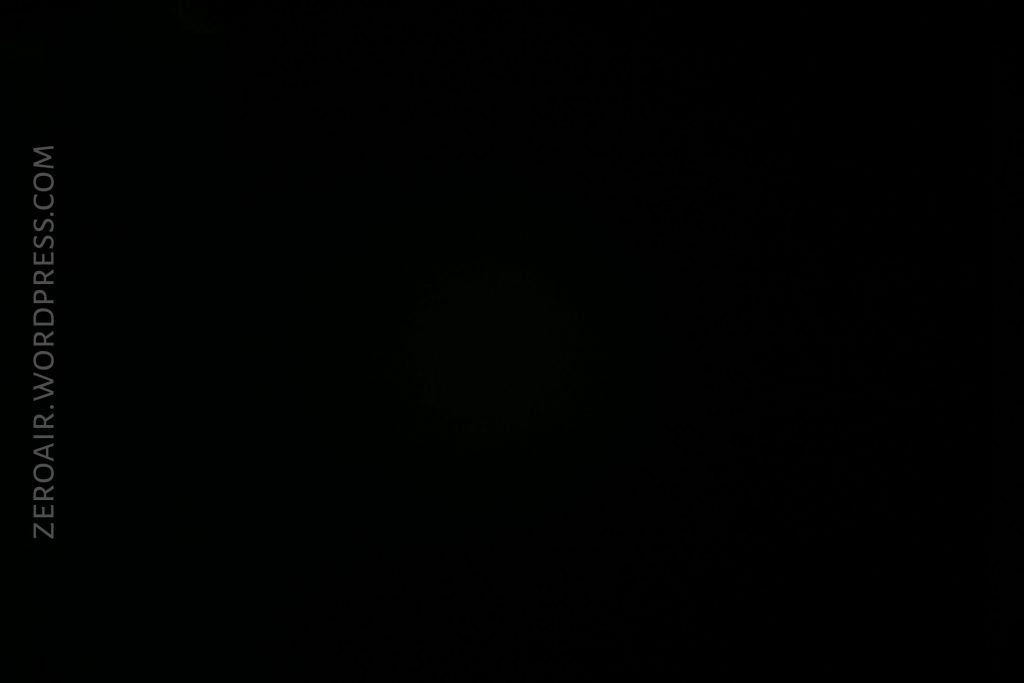 A nearly black image with very minimal visible detail. The text ZEROAIR.WORDPRESS.COM appears vertically on the left side of the image.