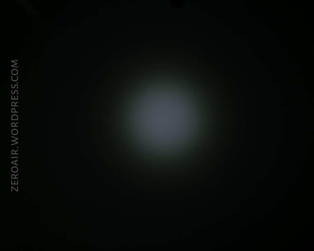 A dark background with a faint, circular white light in the center. The text ZEROAIR.WORDPRESS.COM appears vertically on the left side.