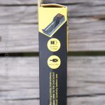 A close-up of a product box side displaying a graphic of a battery charger, icons labeled “Batteries Charger” and “Micro Spin,” and instructions to read the manual, with “Made in China” printed at the bottom.