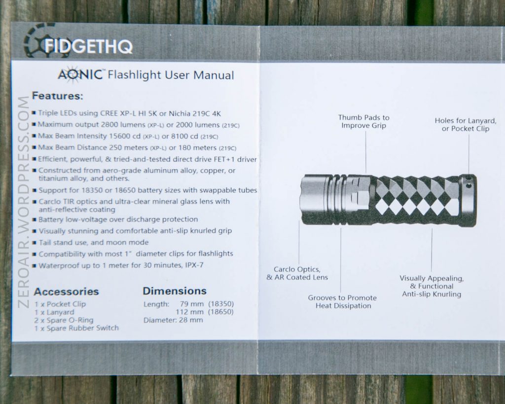 A user manual for the AONIC flashlight lists features, accessories, and dimensions. A labeled diagram beside the text points out the thumb pads, pocket clip, lanyard hole, and lens on the flashlight.