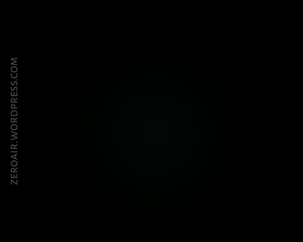 A completely dark image with a barely visible circular shadow in the center. The text ZEROAIR.WORDPRESS.COM is written vertically along the left edge.