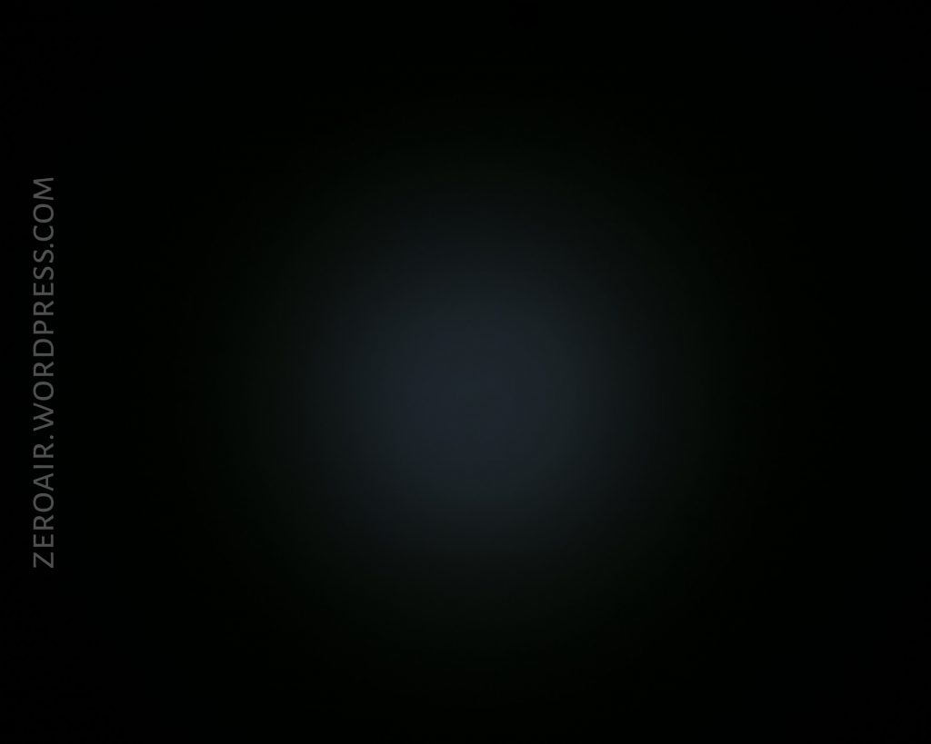 A mostly black image with a faint, circular, dim light in the center; the words ZEROAIR.WORDPRESS.COM appear vertically on the left side.