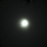 A bright circular light source is at the center of a dark background, creating a gradual halo effect. The text ZEROAIR.WORDPRESS.COM is vertically aligned on the left side.