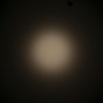 A circular beam of light with soft edges is shown against a dark background. The text ZEROAIR.WORDPRESS.COM appears vertically along the left side of the image.