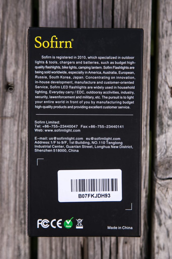 A black Sofirn product box with yellow and white text detailing the company’s background, product uses, certifications, and contact information. A barcode with the code B07FKJDH93 is visible at the bottom.