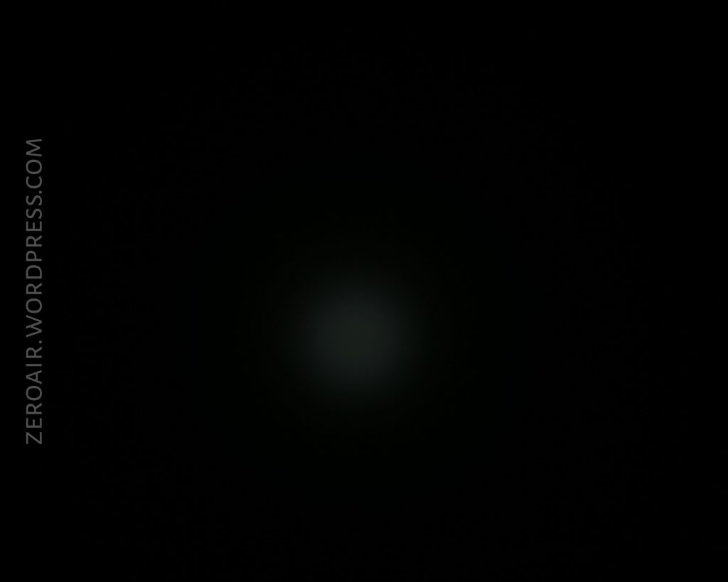A mostly black image with a faint, dim light spot in the center and the text ZEROAIR.WORDPRESS.COM vertically along the left side.