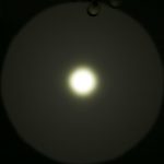 A bright white circle of light shines on a dark background, creating a gradient halo effect. The text ZEROAIR.WORDPRESS.COM is visible along the left side of the image.