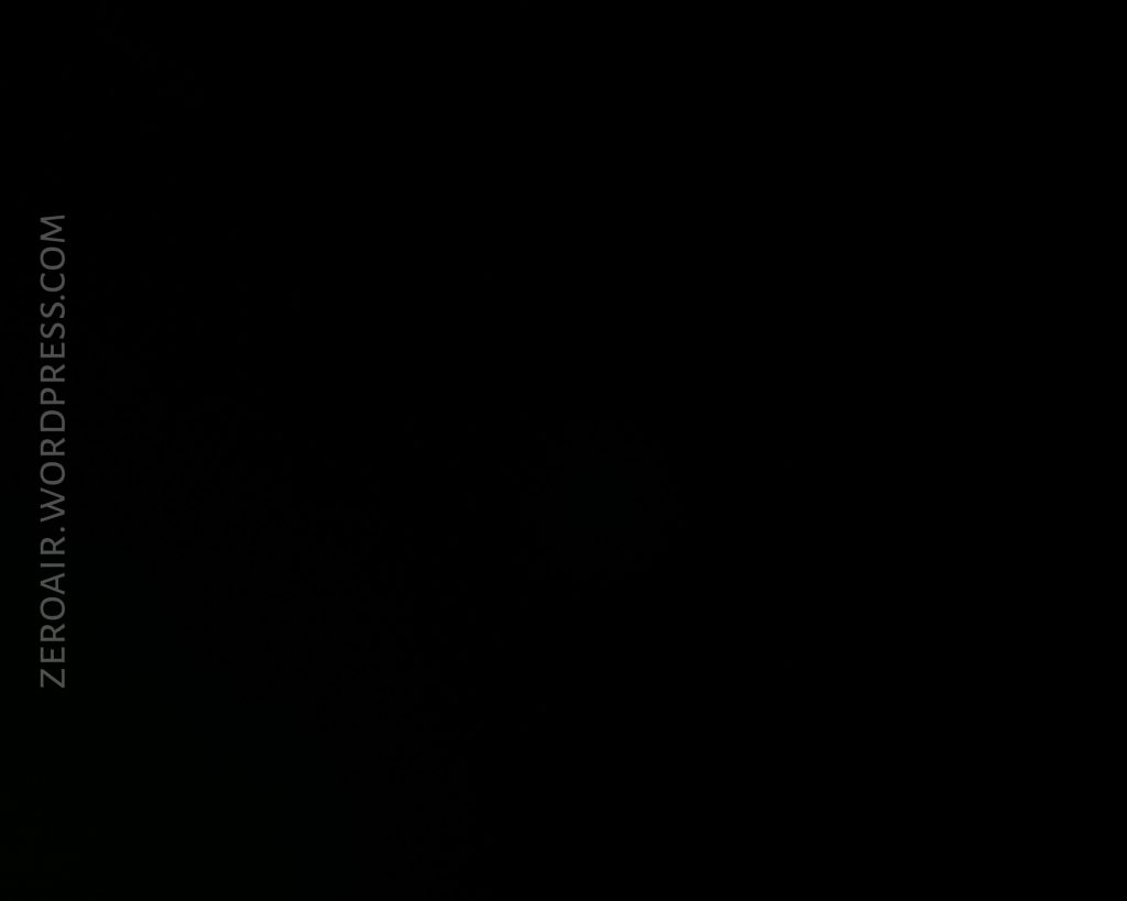 A completely black image with the text “ZEROAIR.WORDPRESS.COM” written vertically in light gray on the left side. No other objects or details are visible.