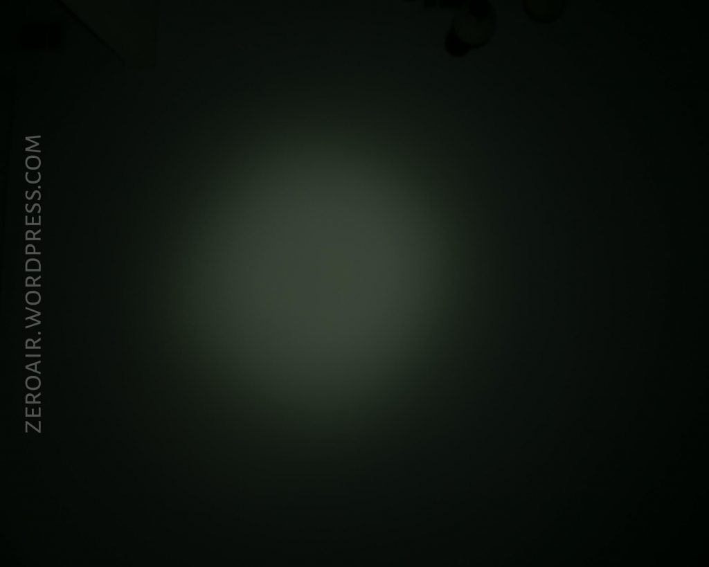 A faint circular beam of light is visible in the center of a mostly dark background. The words “ZEROAIR.WORDPRESS.COM” are written vertically on the left side of the image.