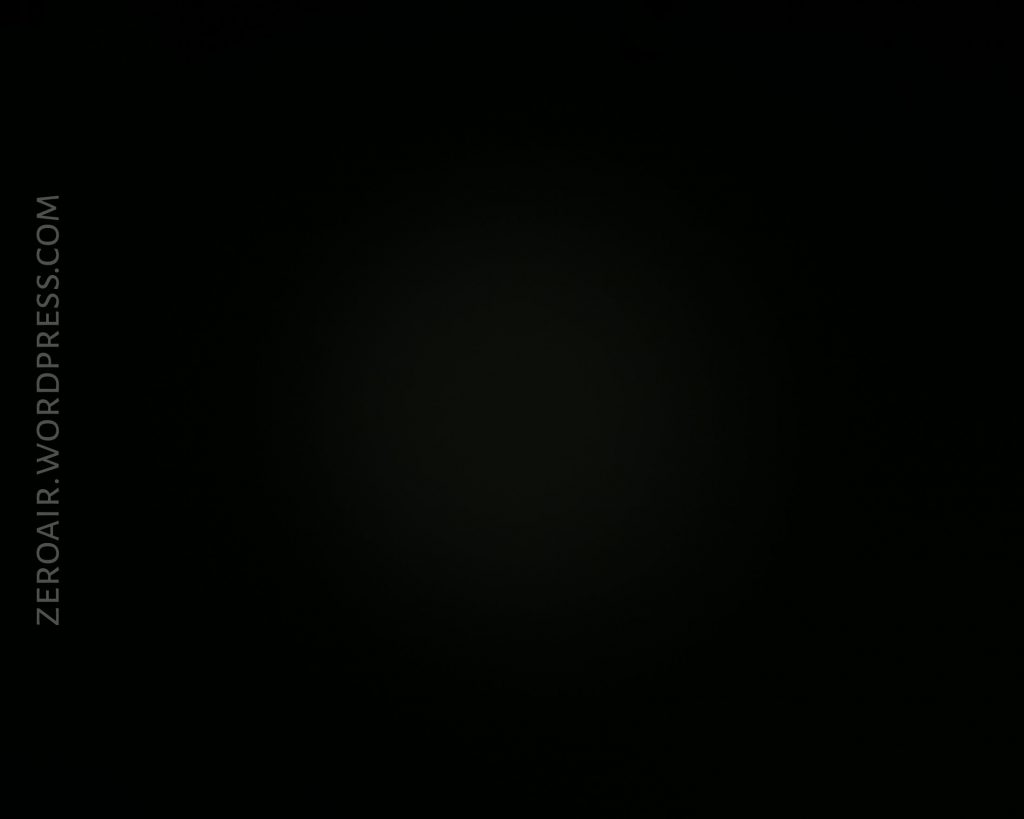 A nearly black image with a faint circular glow in the center. The text ZEROAIR.WORDPRESS.COM appears along the left side in vertical orientation.