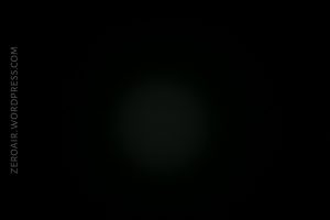 A mostly black image with a faint, soft-edged grayish circle in the center. The text ZEROAIR.WORDPRESS.COM appears vertically along the left edge.