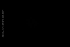 A completely black image with the text ZEROAIR.WORDPRESS.COM in gray, oriented vertically along the left side. No other visible objects or details.