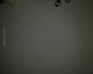 A dimly lit ceiling with a small portion of a light fixture visible in the top right corner. The text ZEROAIR.ORG appears vertically along the left side.