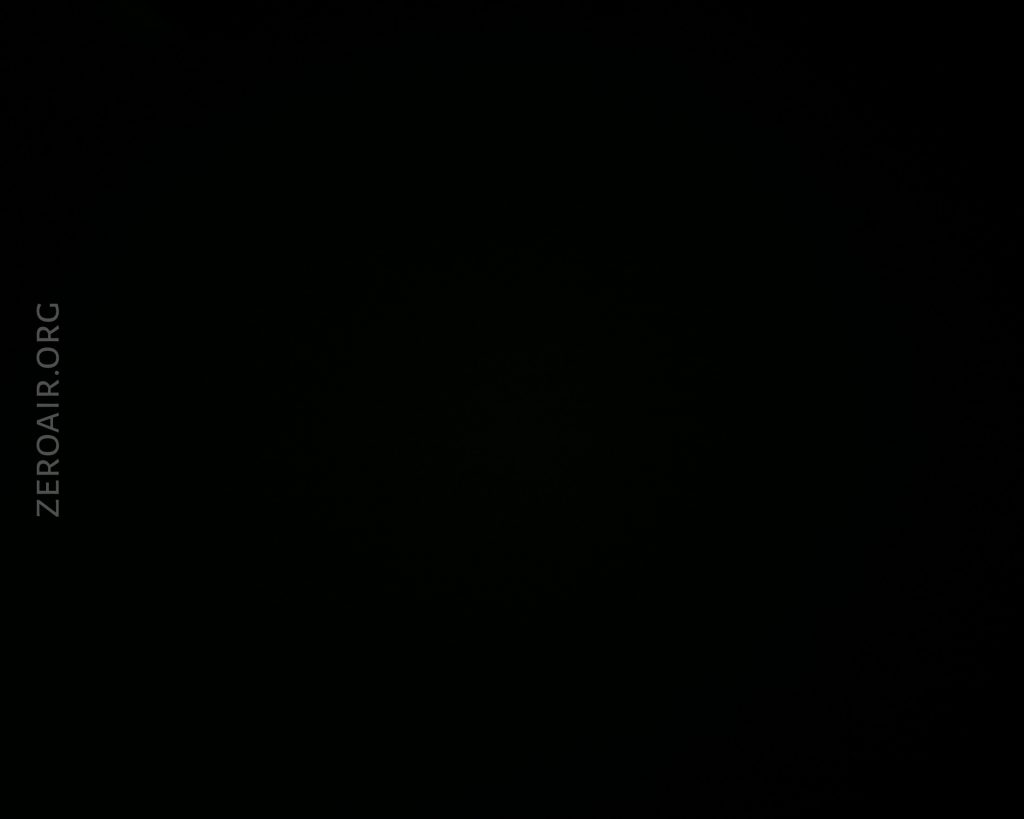 A completely dark image with no distinguishable shapes or objects visible. The text ZEROAIR.ORG appears vertically on the left side of the image.