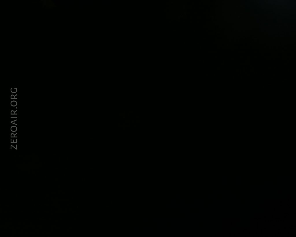 A completely dark image with no visible objects or details. The text ZEROAIR.ORG is vertically positioned on the left side.