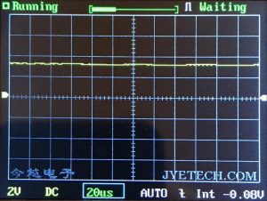A digital oscilloscope screen displays a flat yellow waveform along the center, indicating minimal signal variation. The display shows settings: 2V, DC, 20μs, AUTO, and a voltage of -0.08V.