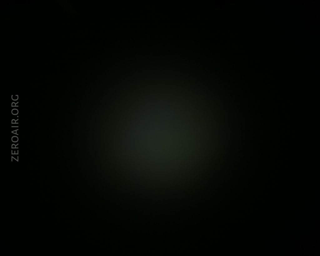 A mostly black image with a faint, slightly lighter circular area in the center. The text ZEROAIR.ORG appears vertically on the left side.