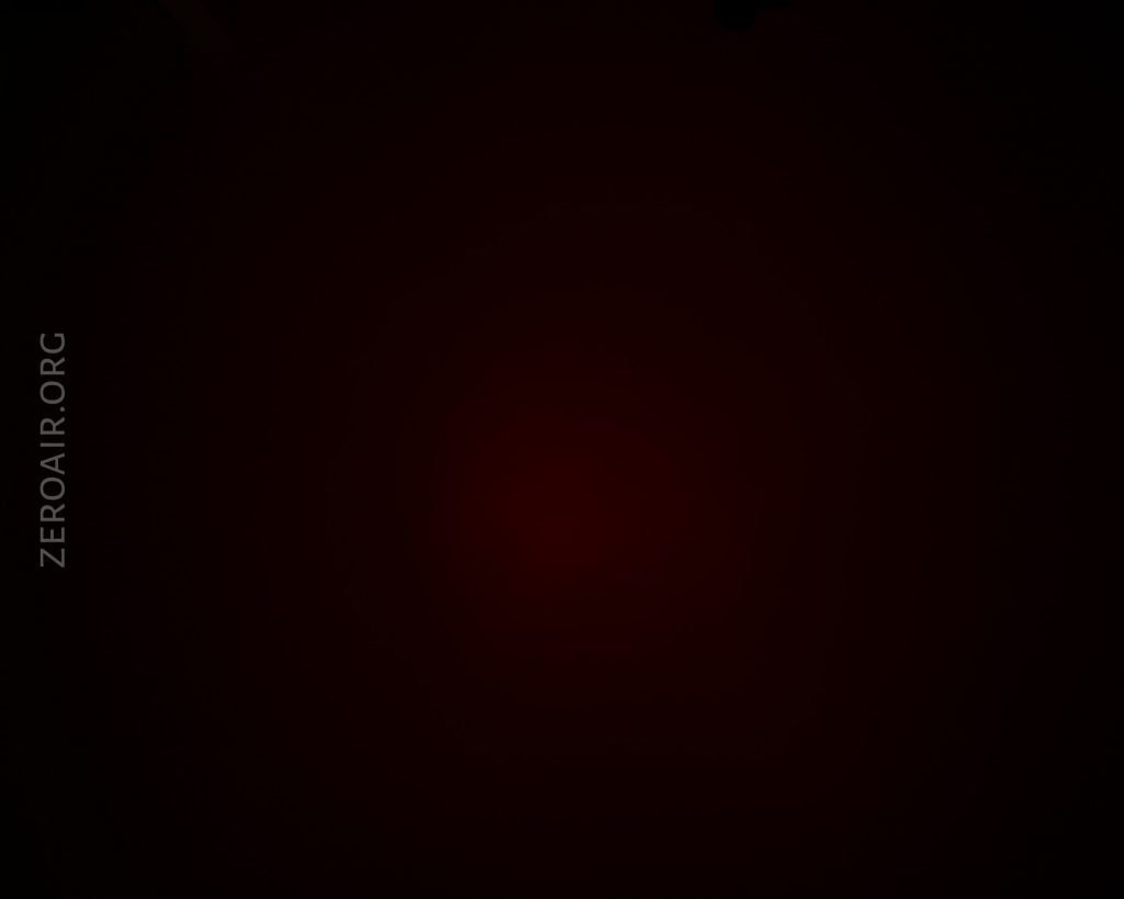 A mostly black image with a faint red glow in the center. The text ZEROAIR.ORG is vertically aligned on the left side of the image.