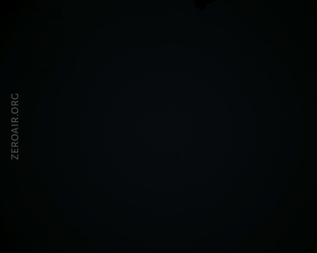A mostly black image with very faint, barely visible text ZEROAIR.ORG oriented vertically along the left side. No other discernible objects or details are visible.