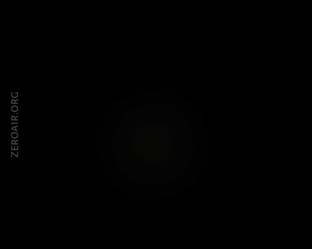 A nearly black image with very faint illumination in the center. The text ZEROAIR.ORG appears vertically on the left side. No other objects or details are visible.