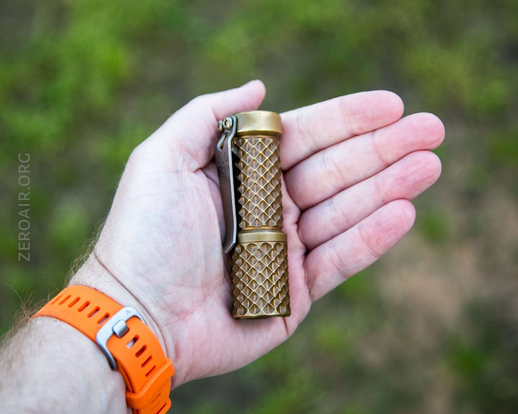 hanko trident total tesseract brass flashlight in hand