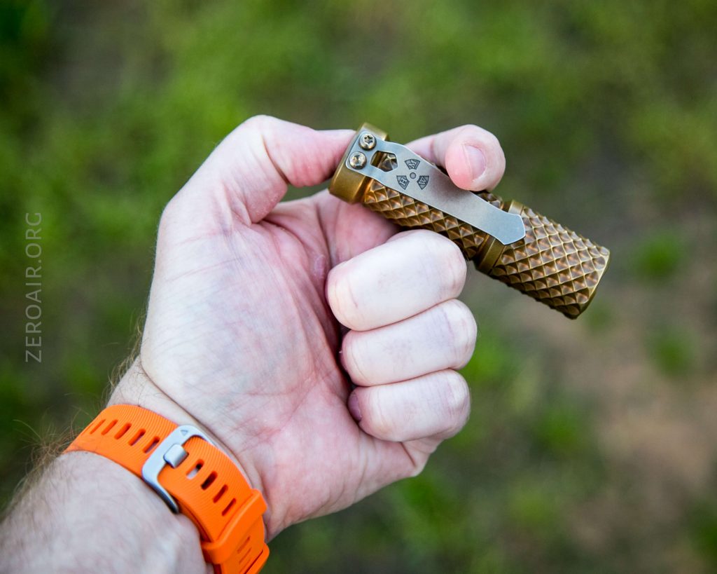 hanko trident total tesseract brass flashlight in hand cigar grip
