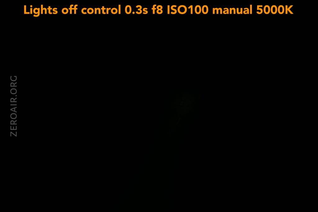 A mostly black image with faint, barely visible shapes. Text at the top reads: Lights off control 0.3s f8 ISO100 manual 5000K. The word ZEROAIR.ORG is faintly visible on the left side.