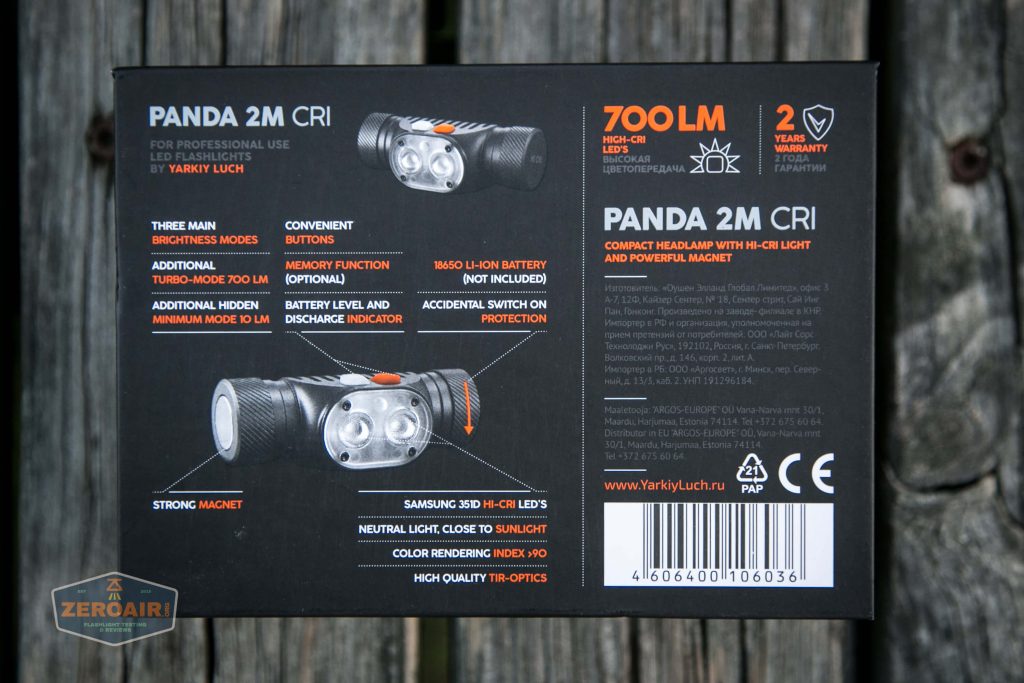The image shows the back of a Panda 2M CRI headlamp box. Key features listed include 700 lumens output, three brightness modes, rechargeability, 18650 Li-ion battery, and a two-year warranty.