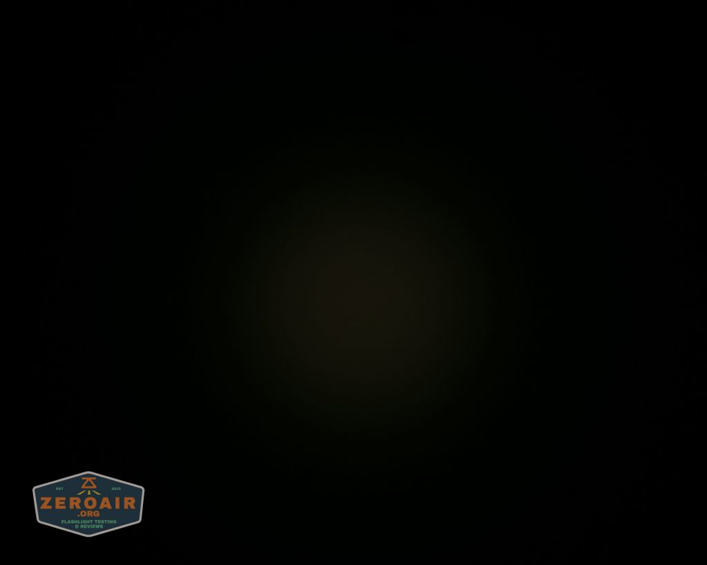A dark image with a faint, barely visible central glow and a Zeroair logo in the lower left corner. The majority of the image is black, with minimal discernible details.
