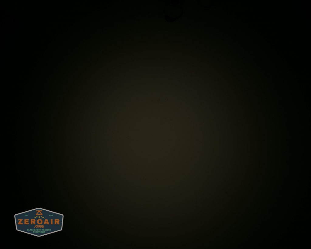 A dark image with a barely visible ZEROAIR logo in orange and blue colors located in the bottom left corner. The rest of the image is mostly black and does not reveal any discernible objects or details.