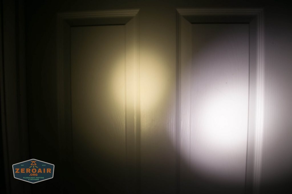 Two flashlight beams of different colors—one yellowish and one white—are cast onto a closed, paneled door. A badge with the text ZeroAir is visible in the lower left corner.